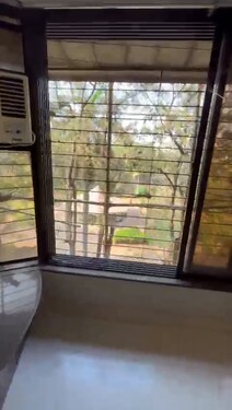 Rental 2bhk semi furnished with near and clean washroom with park view in oshiwara, lokhandwala 