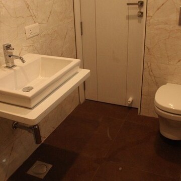 Bathroom in 4 BHK Apartment at Vesu – for Sale