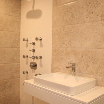 Bathroom in 4 BHK Apartment at Vesu – for Sale