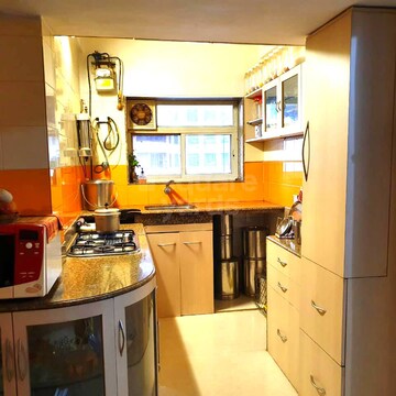 Kitchen in 2 BHK Apartment at Oshiwara Gulmohar Apartment, Andheri West – for Sale