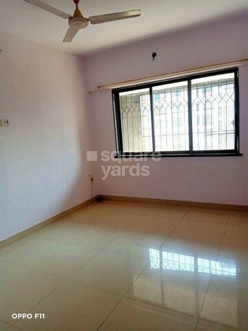Room in 2 BHK Apartment at Palash Towers, Andheri West – for Rent