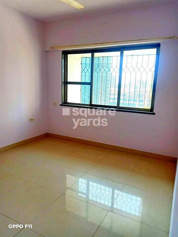 Bedroom in 2 BHK Apartment at Palash Towers, Andheri West – for Sale