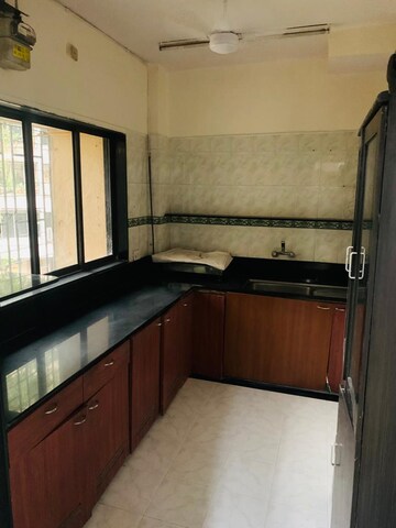 Kitchen in 1 BHK Apartment at Lokhandwala Complex – for Sale
