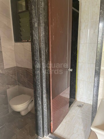 Bathroom in 1 BHK Apartment at Kamdhenu Aura, Taloja – for Sale