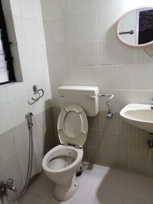 Bathroom in 2 BHK Apartment at Amrut Runwal Daffodils, Nibm – for Rent