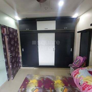 Bedroom in 2 BHK Apartment at Prism Enclave, Kandivali East – for Sale
