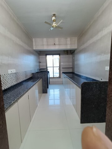 Kitchen in 3 BHK Apartment at Asmita Sand Dunes, Malad West – for Rent