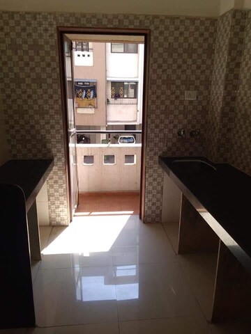 Kitchen in 1 BHK Apartment at Nanda Amrut Residency, Boisar – for Rent