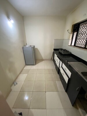 Kitchen in 1 BHK Apartment at Dorabjee Enclave, Salunkhe Vihar Society – for Rent