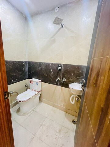 Bathroom in 3 BHK Builder Floor at Dwarka Mor – for Sale