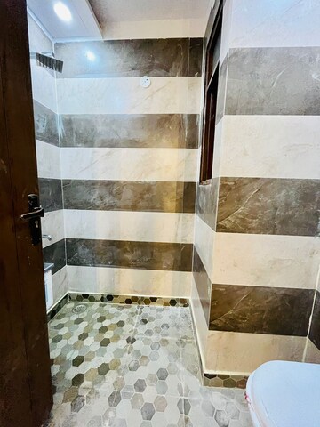 Bathroom in 3 BHK Builder Floor at Dwarka Mor – for Sale