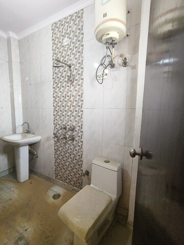 Bathroom in 3 BHK Builder Floor at Dwarka Mor – for Sale