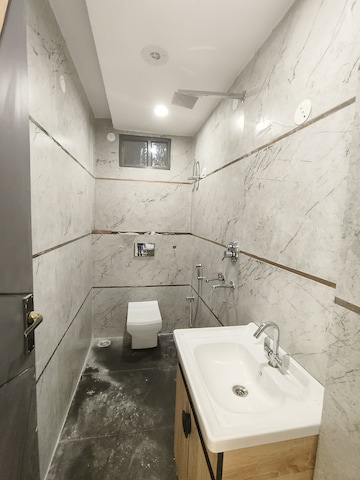 Bathroom in 3 BHK Builder Floor at Dwarka Mor – for Sale
