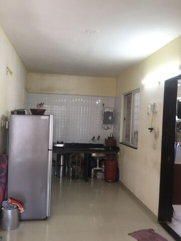 Kitchen in 2 BHK Apartment at Whistling Winds, Pisoli – for Sale