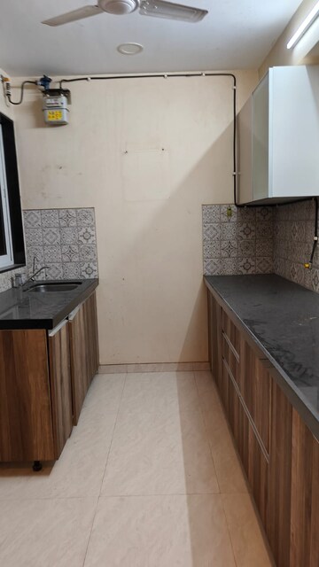 Kitchen in 2 BHK Apartment at Lokhandwala Complex – for Sale