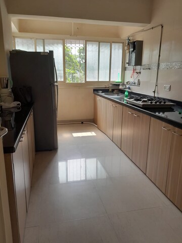 Kitchen in 2 BHK Apartment at Karachi Citizens CHS, Juhu – for Sale