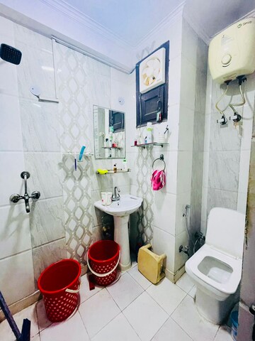 Bathroom in 3 BHK Builder Floor at Dwarka Mor – for Rent