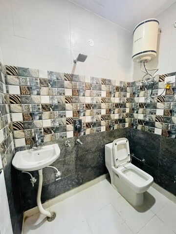 Bathroom in 3 BHK Builder Floor at Dwarka Mor – for Rent