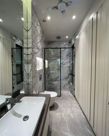 Bathroom in 3.5 BHK Apartment at Ambience Island Lagoon, Sector 24 – for Sale