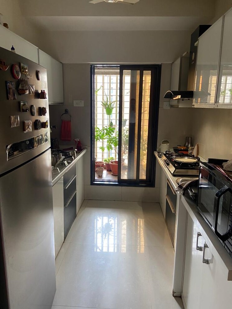 Kitchen, unique-greens-ghodbunder-road 2 Bedroom 660 Sq.Ft. Apartment In Ghodbunder Road Thane 6308038