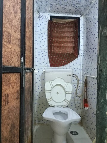 Bathroom in 1 BHK Apartment at Kharigaon – for Sale