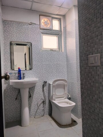 Bathroom in 3 BHK Apartment at Urban Axis Urban Woods, Sushant Golf City – for Rent
