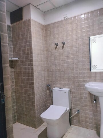 Bathroom in 3 BHK Apartment at Urban Axis Urban Woods, Sushant Golf City – for Rent