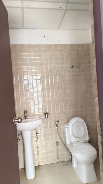 Bathroom in 2 BHK Apartment at Urban Axis Urban Woods, Sushant Golf City – for Rent