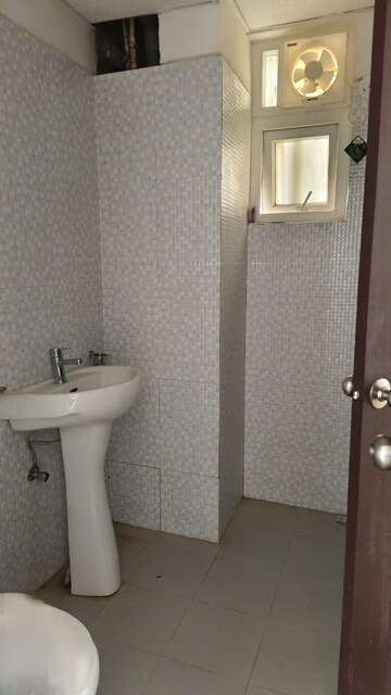 Bathroom in 2 BHK Apartment at Urban Axis Urban Woods, Sushant Golf City – for Rent