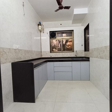 Kitchen in 3 BHK Apartment at Naupada – for Sale