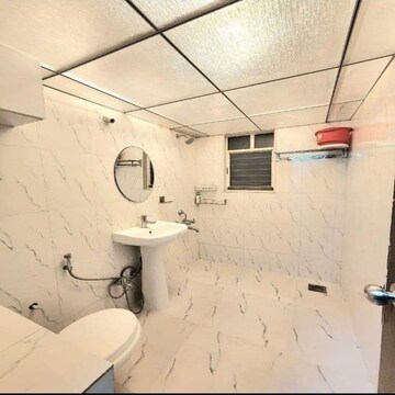 Bathroom in 3 BHK Apartment at Salarpuria H And M Royal, Kondhwa – for Rent