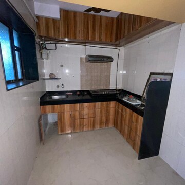 Kitchen in 1 BHK Apartment at Alaknanda CHS, Rawalpada – for Sale