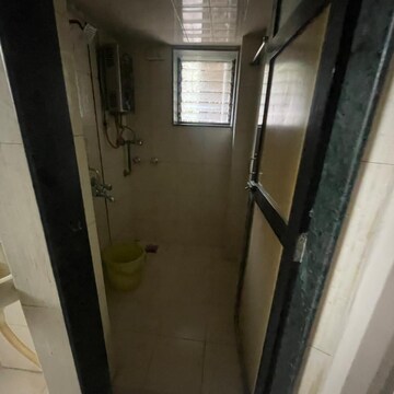 Bathroom in 1 BHK Apartment at Alaknanda CHS, Rawalpada – for Sale