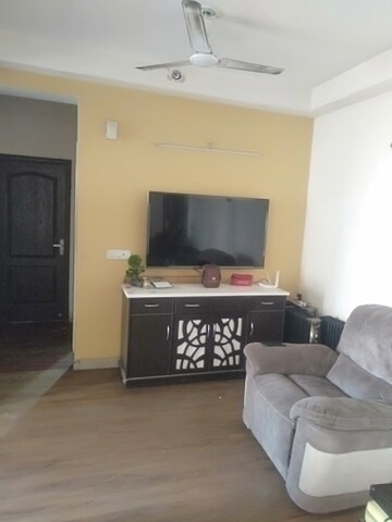 Living Room in 3.5 BHK Apartment at Aims Golf City, Sector 75 – for Sale