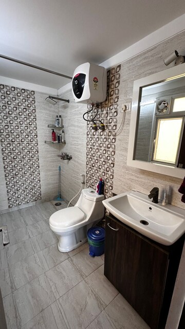Bathroom in 3 BHK Apartment at Sunworld Vanalika, Sector 107 – for Sale
