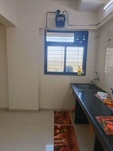 Kitchen in 1 BHK Apartment at Raunak Unnathi Woods Phase 7 A And B, Ghodbunder Road – for Sale