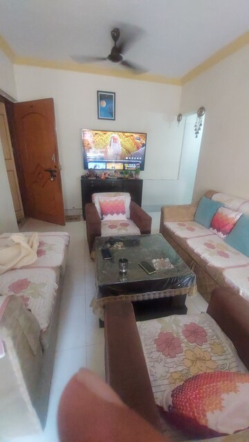 Living Room in 2 BHK Apartment at Shree Vallabh Anand CHS, Malad West – for Rent