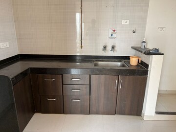 Kitchen in 1.5 BHK Apartment at Nyati Evita, Dhanori – for Sale