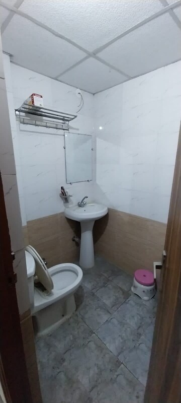 Bathroom in 2 BHK Apartment at Sangwan Heights, Raj Nagar Extension – for Sale