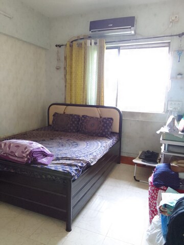 Bedroom in 2 BHK Apartment at Divya Srushti CHS, Kandivali West – for Rent