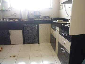 Kitchen in 2 BHK Apartment at Gangadham Apartment, Market Yard – for Sale