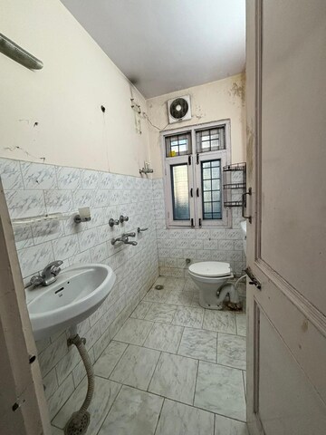 Bathroom in 3 BHK Apartment at Vikasnagar – for Sale