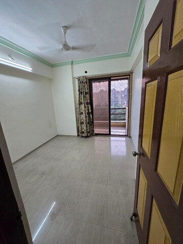 Room in 2 BHK Apartment at New Krishna Tower, Kopar Khairane – for Sale