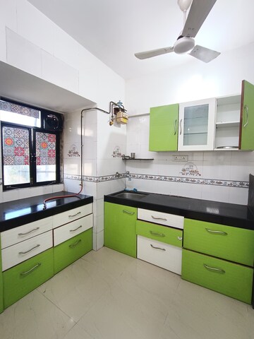 Kitchen in 1 BHK Apartment at Golders Green CHS, Borivali West – for Sale