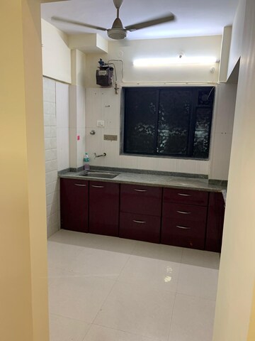 Kitchen in 1 BHK Apartment at Cosmos Orchid, Ghodbunder Road – for Sale