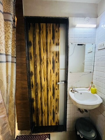 Bathroom in 2 BHK Apartment at Pragati Crystal, Ulwe – for Rent