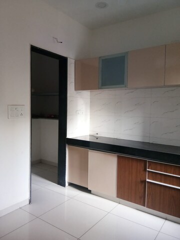 Kitchen in 2 BHK Apartment at Dev Aurum, Prahlad Nagar – for Sale