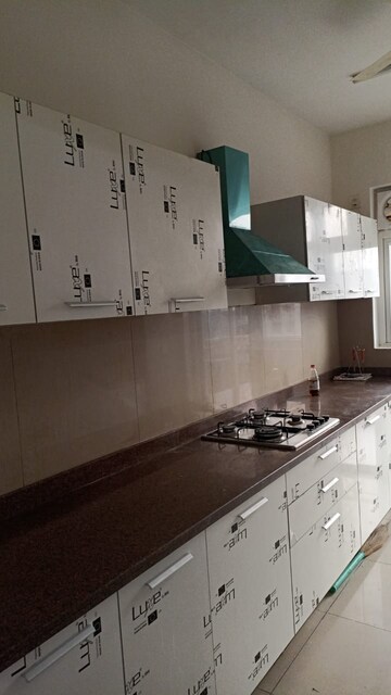 Kitchen in 3.5 BHK Apartment at Emaar Palm Gardens, Sector 83 – for Sale