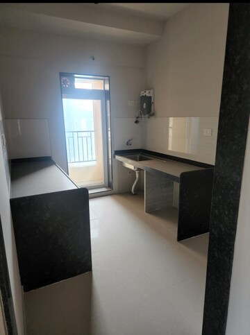 Kitchen in 2 BHK Builder Floor at Rustomjee Azziano Wing D, Majiwada – for Sale