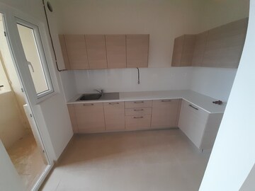 Kitchen in 2 BHK Apartment at Bhartiya Nikoo Homes Phase 2, Thanisandra Main Road – for Sale